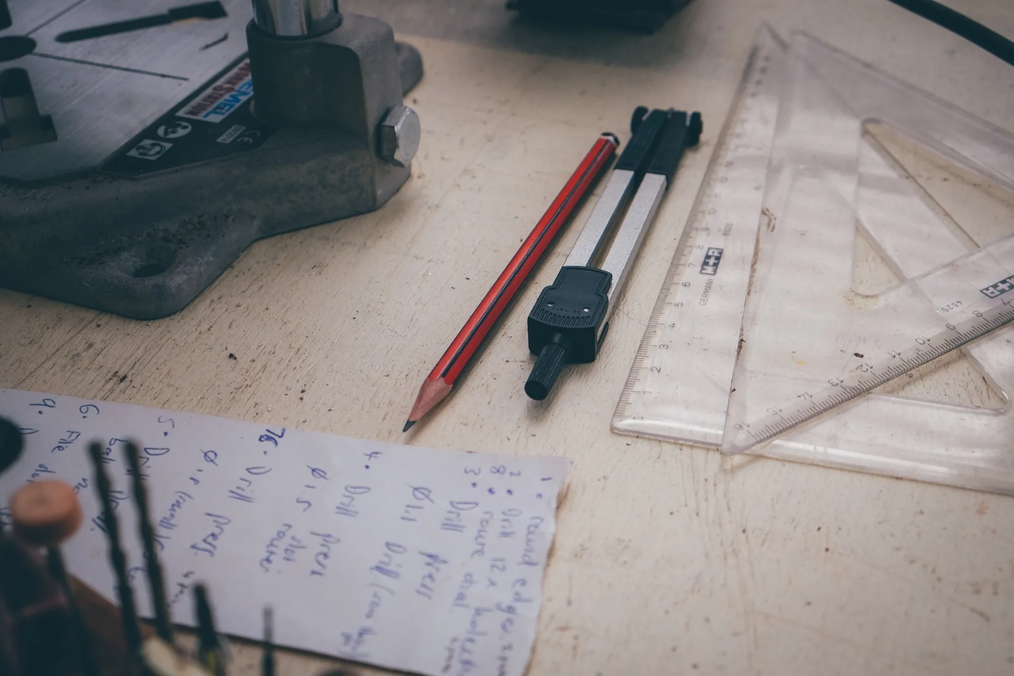 Pencil, ruler and handwritten measurements laid out for a watch case